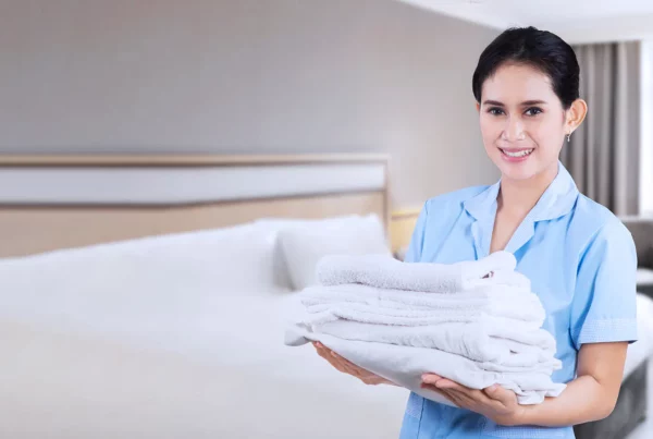 Maid holding towels