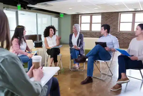 a group of people in a meeting